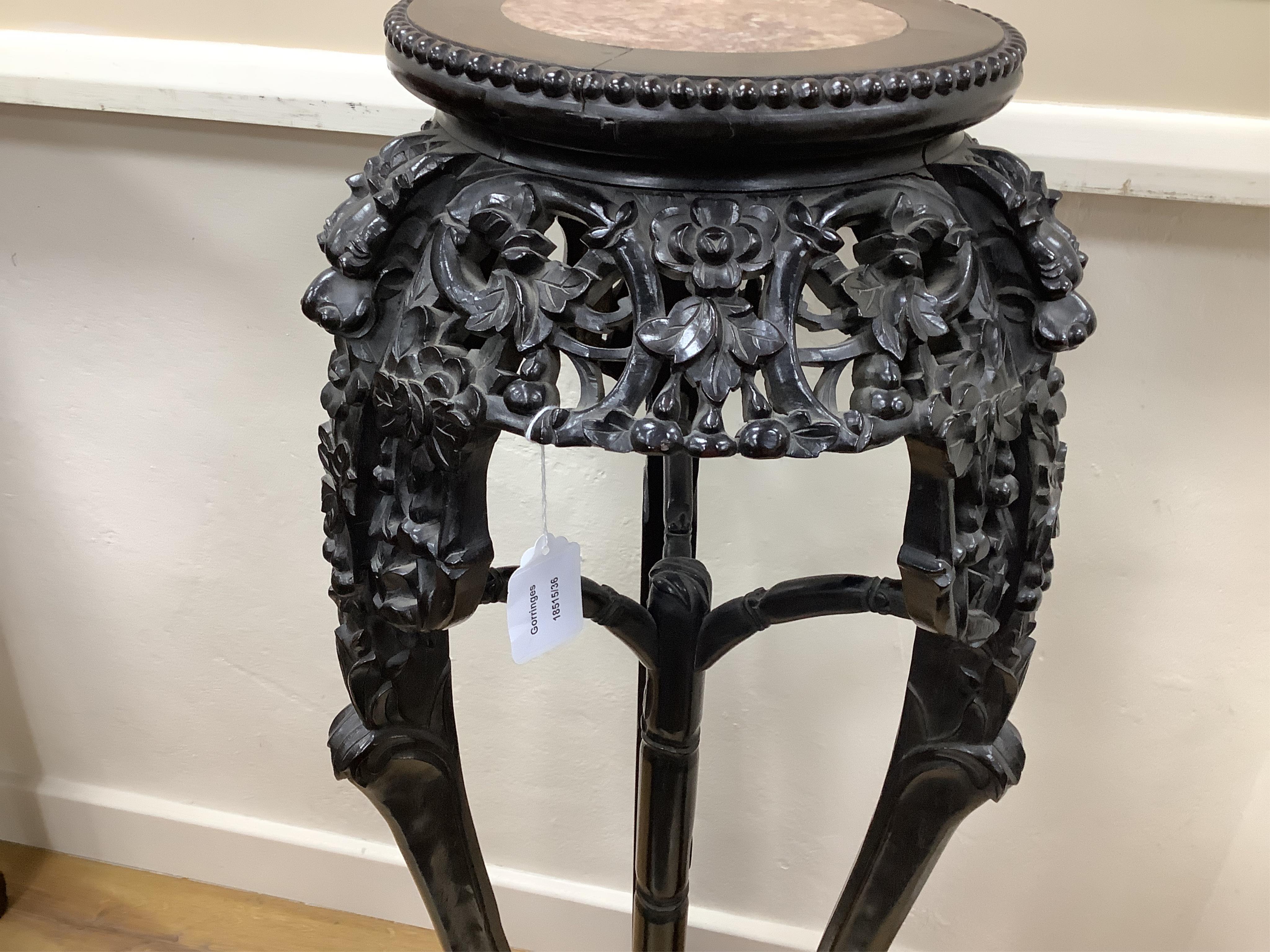 A Chinese marble topped vase stand, diameter 34cm, height 94cm